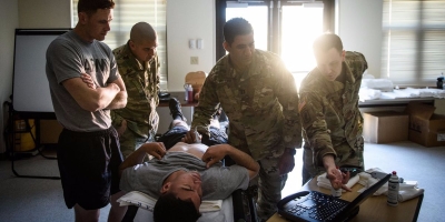 MAJ Jonathan Monti, EMPA, teaches medics in the 82nd Airborne Division how to use ultrasound.